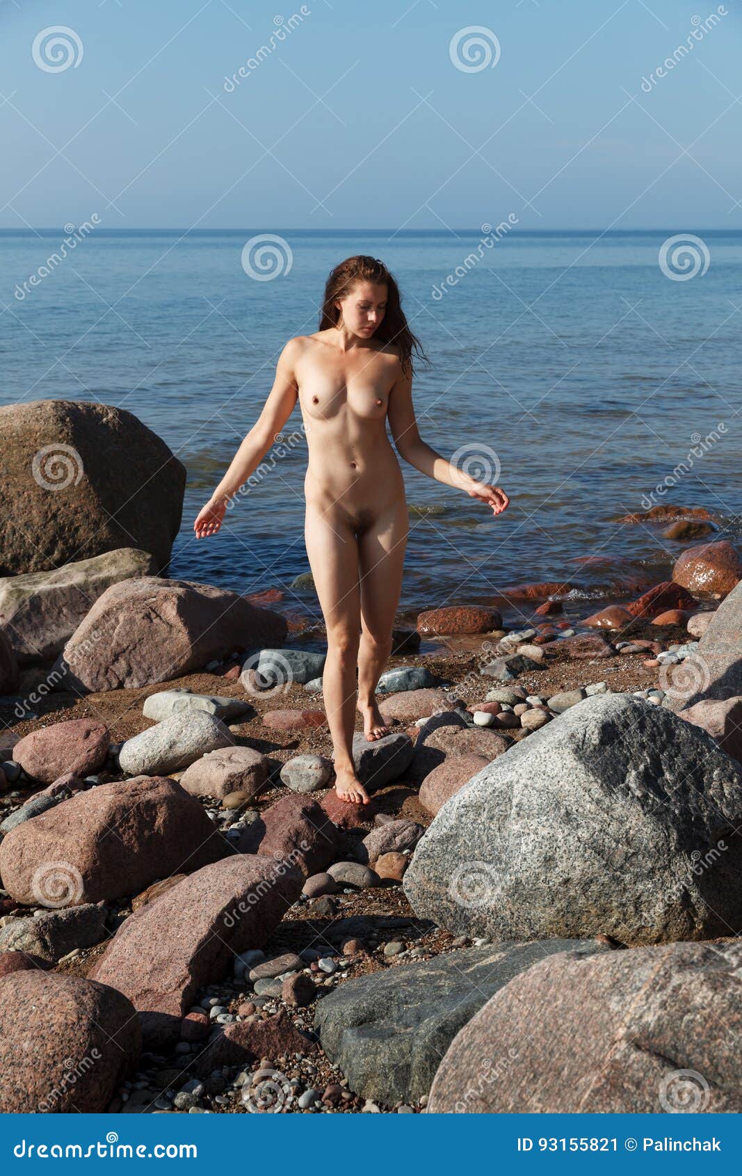 naked girl outdoors enjoying nature stock
